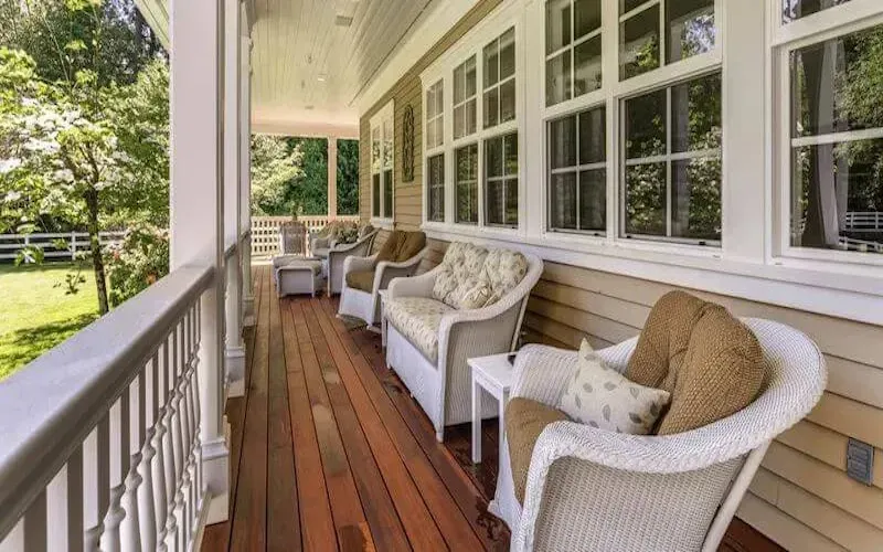 dark-stained-wood-deck-on-front-porch